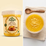 Apna Zaiqah pure cow desi ghee tub next to a bowl of desi ghee
